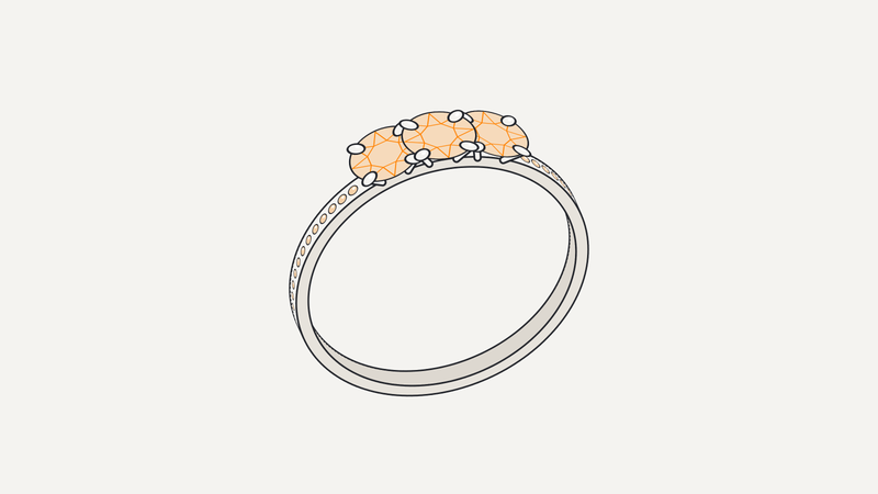 Illustrazione di anello trilogy con tre pietre arancio a quattro griffe e gambo pavé – Gioielleria Scaduto